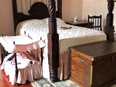 11A The young daughters room has a wooden framed canopy bed and a matching cot for her doll Devon House mansion Kingston Jamaica